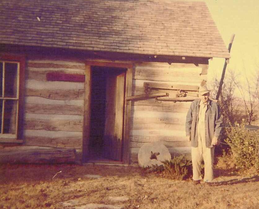 1964 Henry at cabin with grindstone from Matfield mill