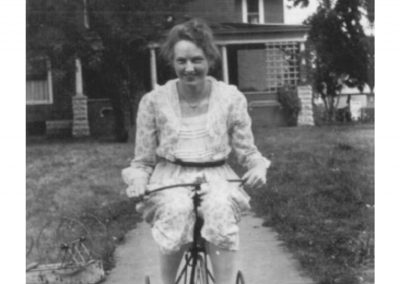 1920 - Maud Rogler rides a bicycle