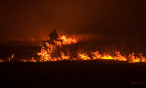 ATV riding through flames