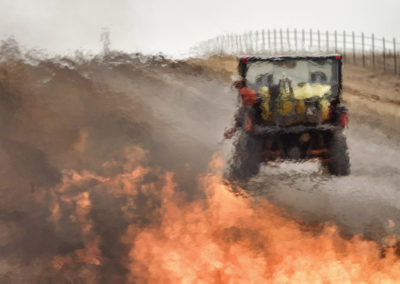 Rancher starting burn from ATV, photographed through heat thermals