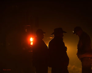 Ranchers visiting on the road during a burn